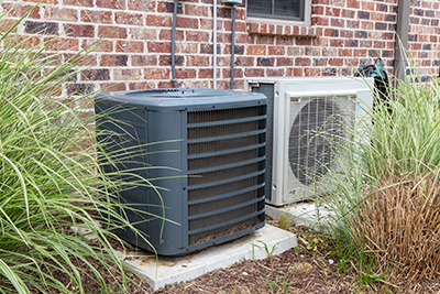 heat pump system and mini-split next to each other.