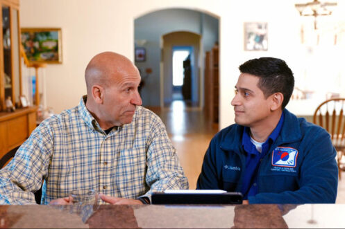 HVAC Technician with Customer During Indoor Air Quality Service in Middletown, NY